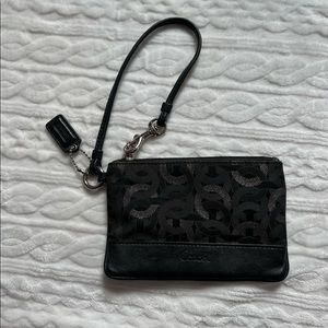 Black and silver Coach wristlet